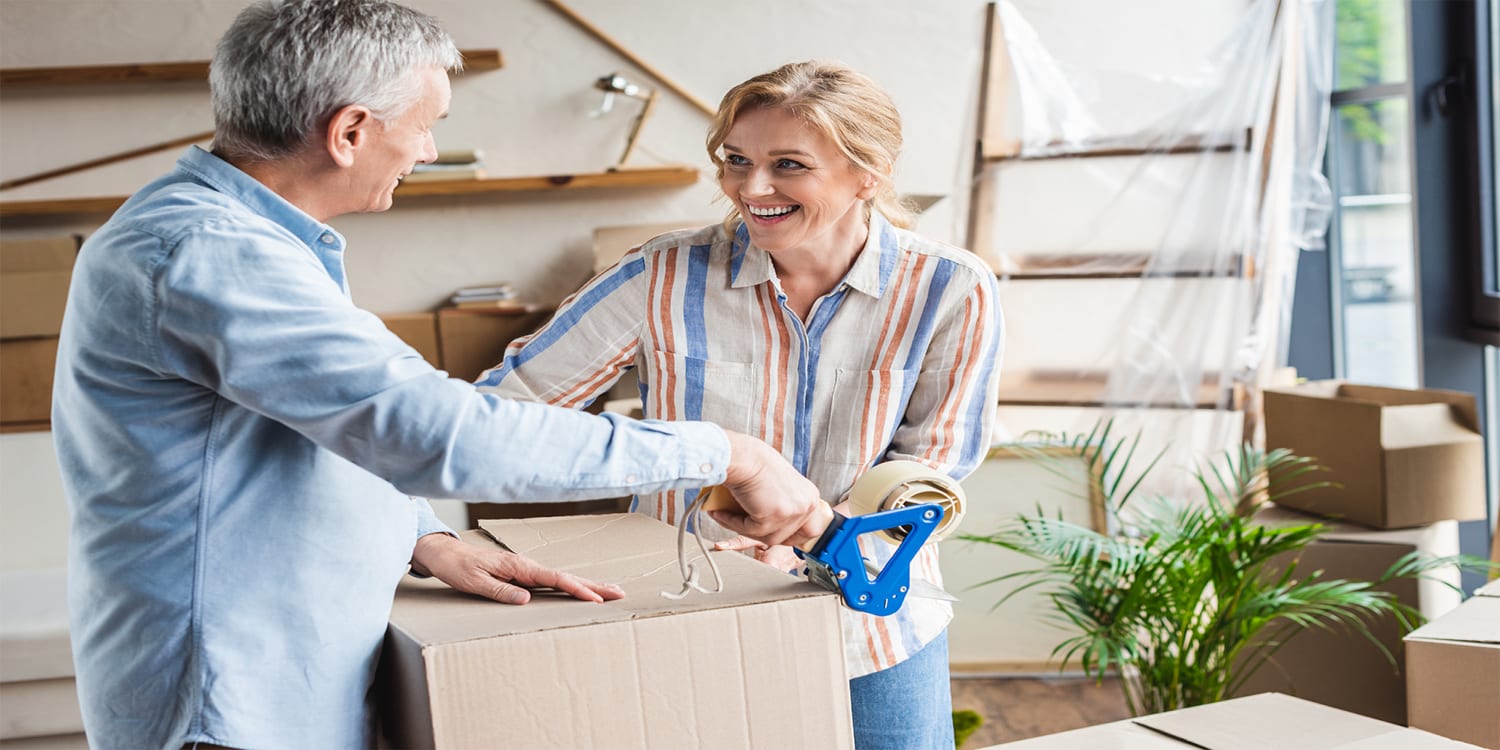 Couple packing during a home sale